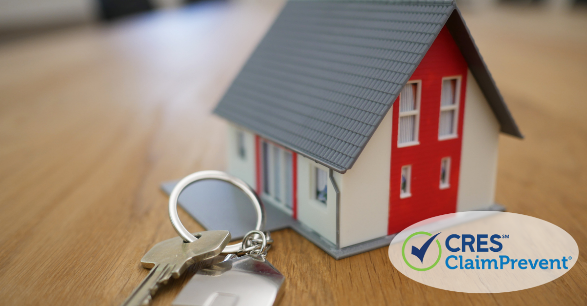 Scale model of a home with keys