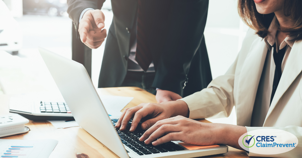 business man and woman typing