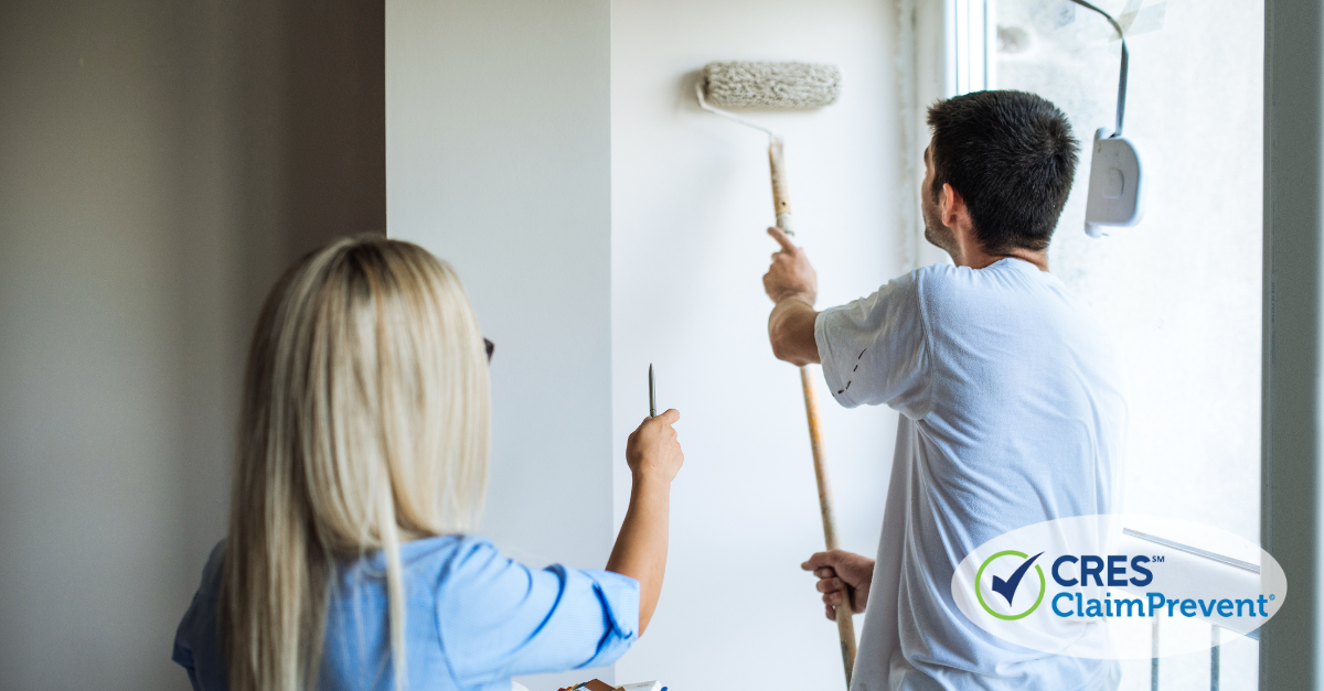 woman pointing man painting