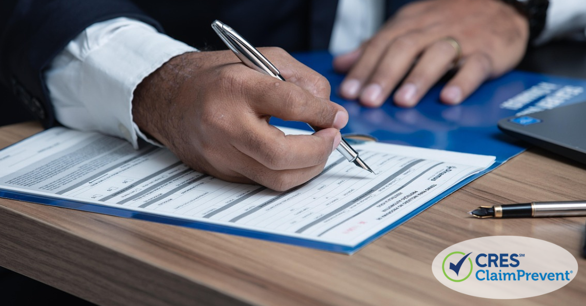 Man at desk filling out paperwork