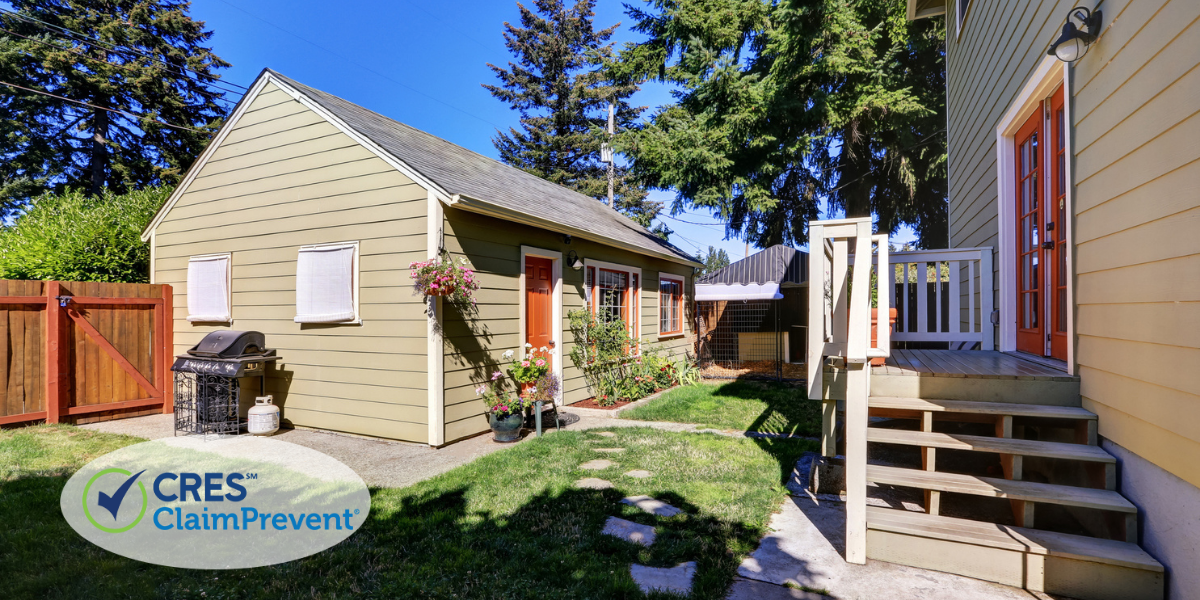 Detached accessory dwelling unit (ADU) located behind a single-family home with separate entrance and backyard access.